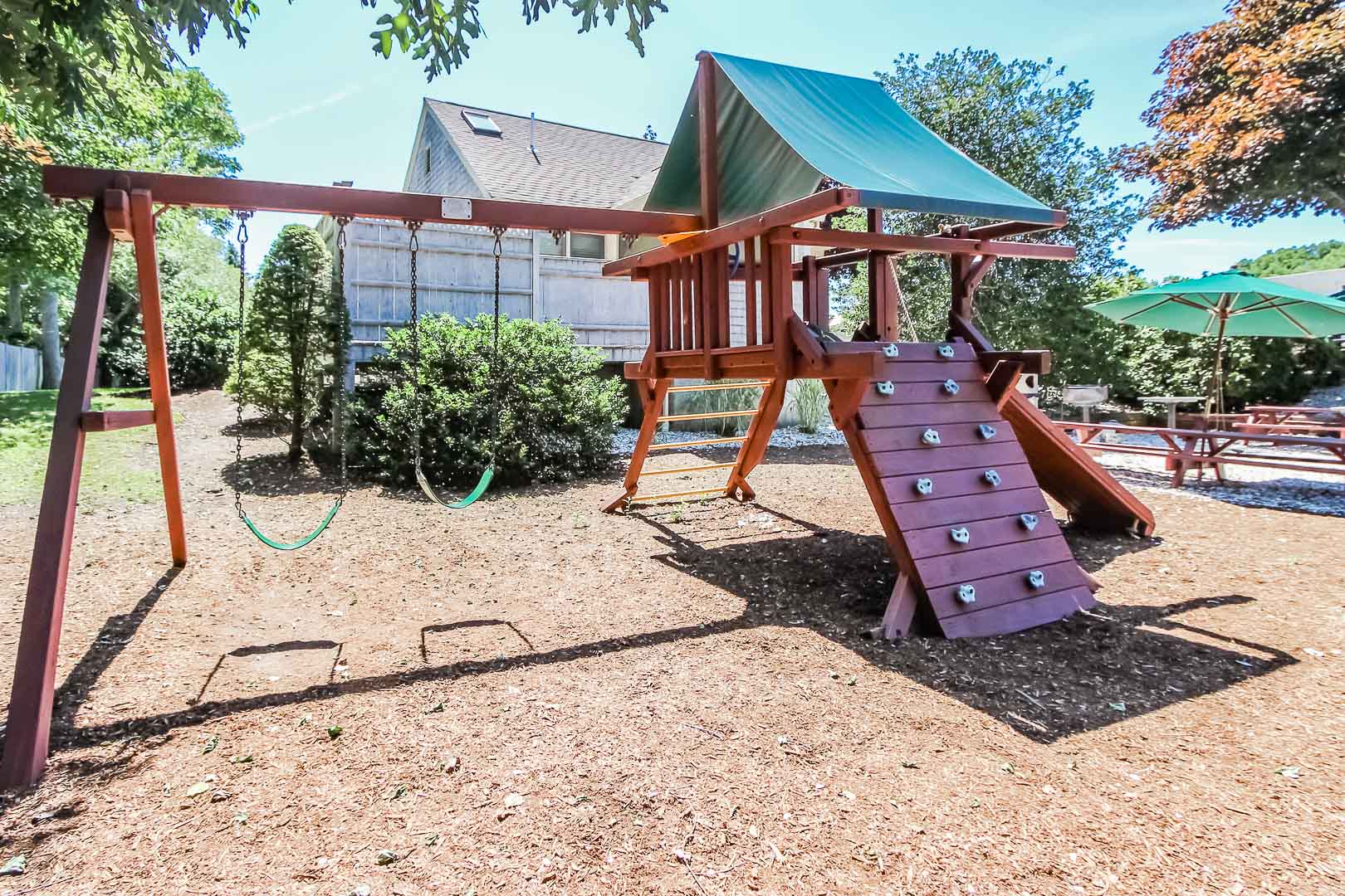 a charming playground for kids at VRI's Holly Tree Resort in Massachusetts.
